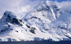 Preview wallpaper winter, mountains, ice, stones, cold, clouds, ocean