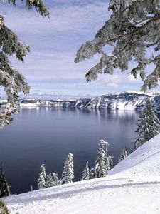 Preview wallpaper winter, mountains, snow, stones, cold, slope, coast, trees