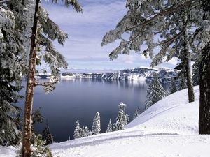 Preview wallpaper winter, mountains, snow, stones, cold, slope, coast, trees