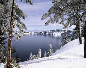 Preview wallpaper winter, mountains, snow, stones, cold, slope, coast, trees