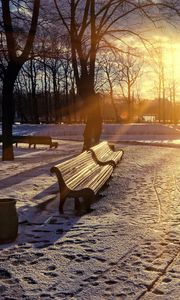 Preview wallpaper winter, park, sunset, bench, snow, sun