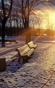 Preview wallpaper winter, park, sunset, bench, snow, sun