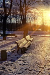 Preview wallpaper winter, park, sunset, bench, snow, sun