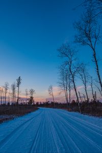 Preview wallpaper winter, road, trees, horizon, sky