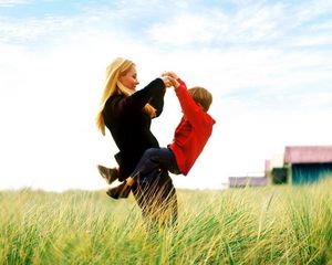 Preview wallpaper woman, boy, grass, sky, joy