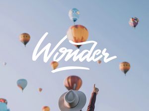 Preview wallpaper wonder, balloons, sky, inscription, girl, hat