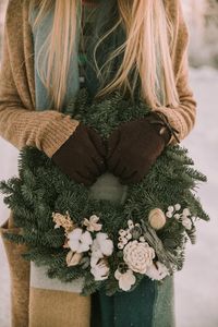 Preview wallpaper wreath, christmas, new year, hands, girl, winter