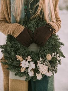 Preview wallpaper wreath, christmas, new year, hands, girl, winter