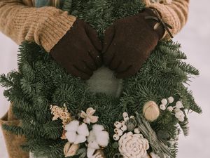 Preview wallpaper wreath, christmas, new year, hands, girl, winter