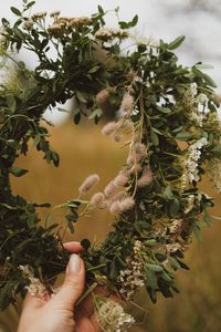 Preview wallpaper wreath, hand, flowers, grass, fingers