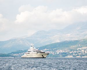 Preview wallpaper yacht, ship, sea, mountains, houses