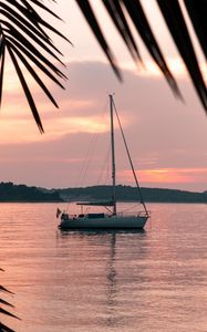 Preview wallpaper yacht, water, sunset, sea, bay, shore