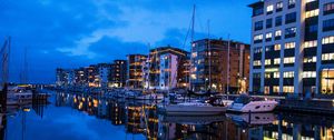 Preview wallpaper yachts, buildings, lights, reflection, water, bay, evening