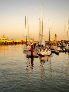 Preview wallpaper yachts, masts, pier, lighthouse