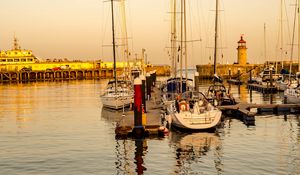 Preview wallpaper yachts, masts, pier, lighthouse