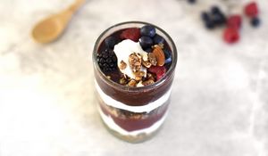 Preview wallpaper yogurt, raspberries, blueberries, blackberries, nuts, chocolate